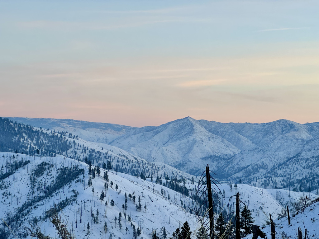Snow-covered mountain range at dusk